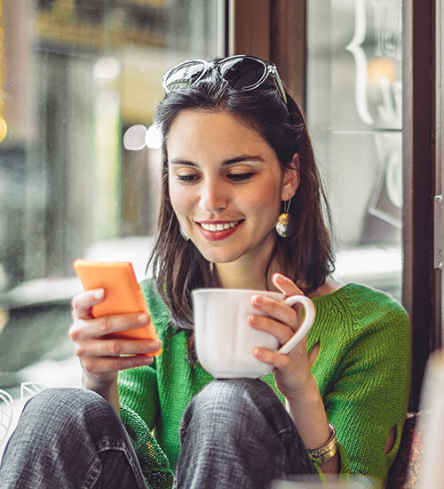 woman on phone in coffee shop