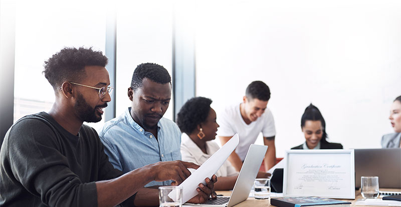 Young professionals collaborating in a modern office setting.