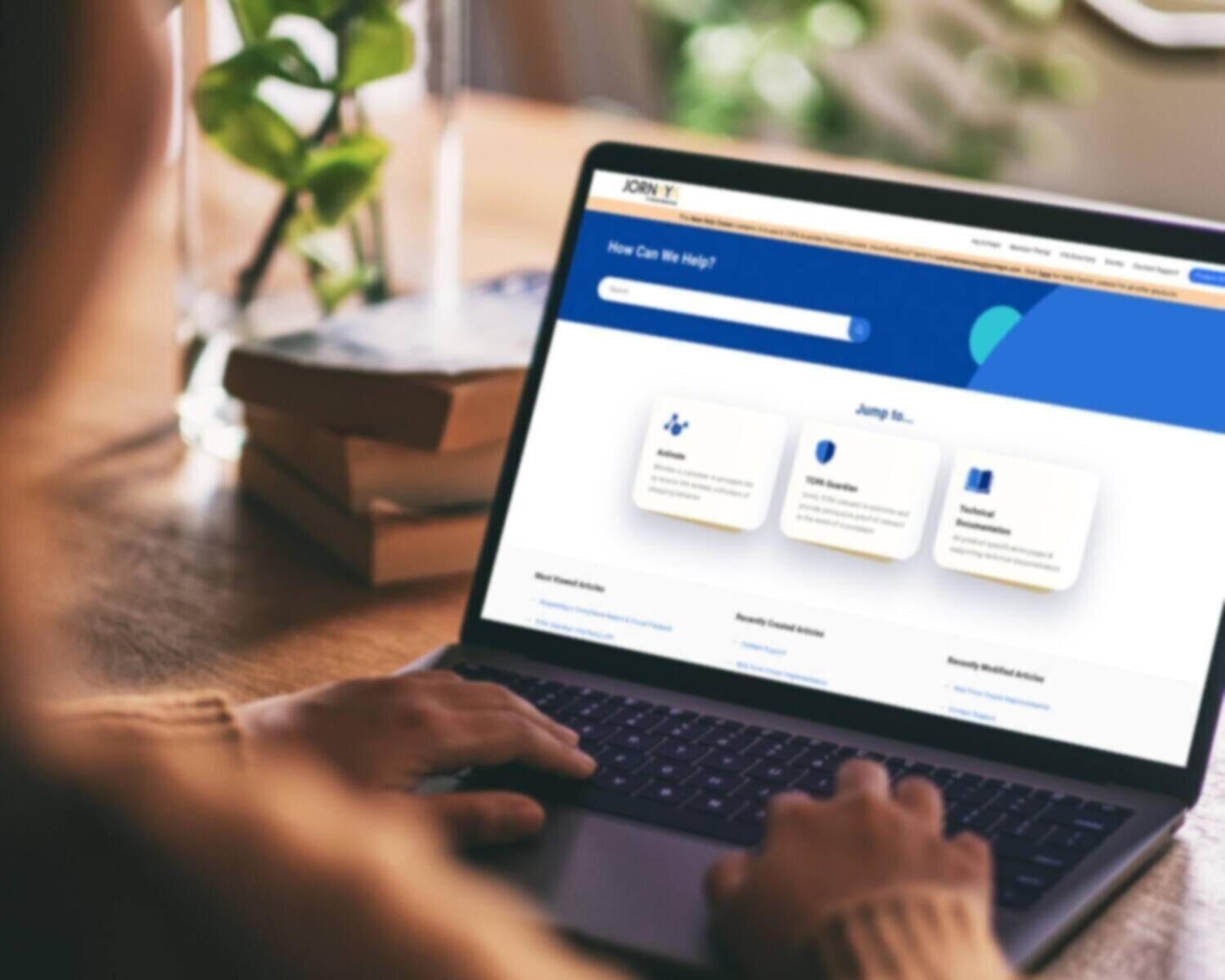 Person using laptop to search on a help center website.