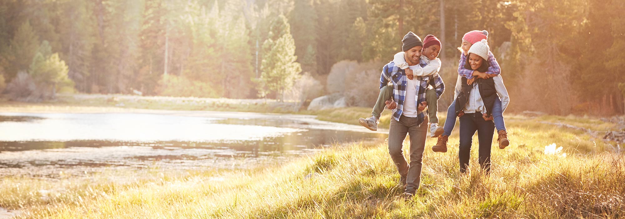 family-hiking-together-in-sunlit-forest