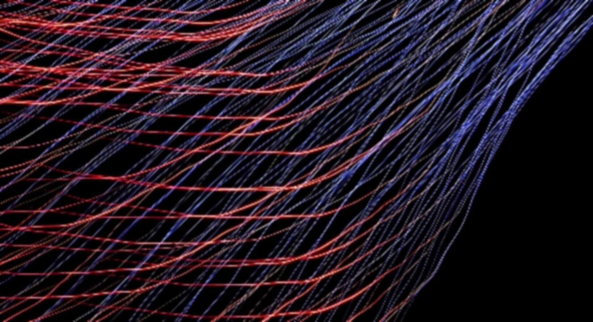 Colorful abstract light trails on a dark background