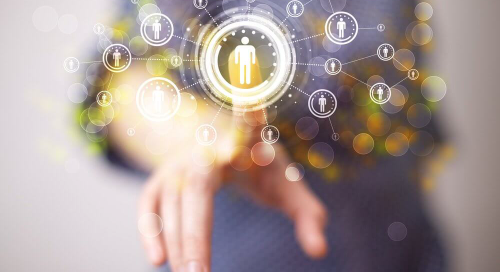 Hand interacting with futuristic digital network interface.