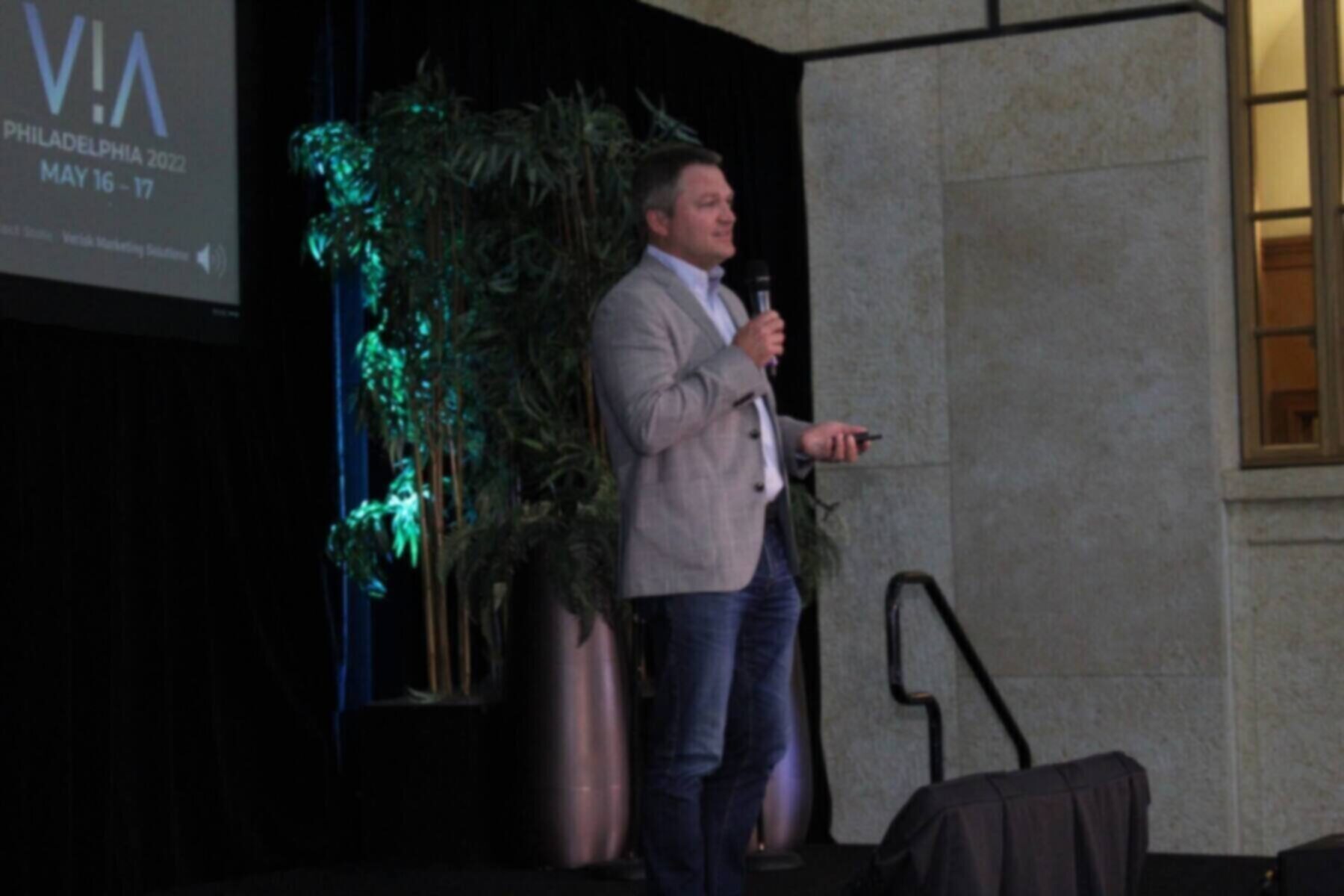 Person speaking on stage at VIA Conference 2022 in Philadelphia.