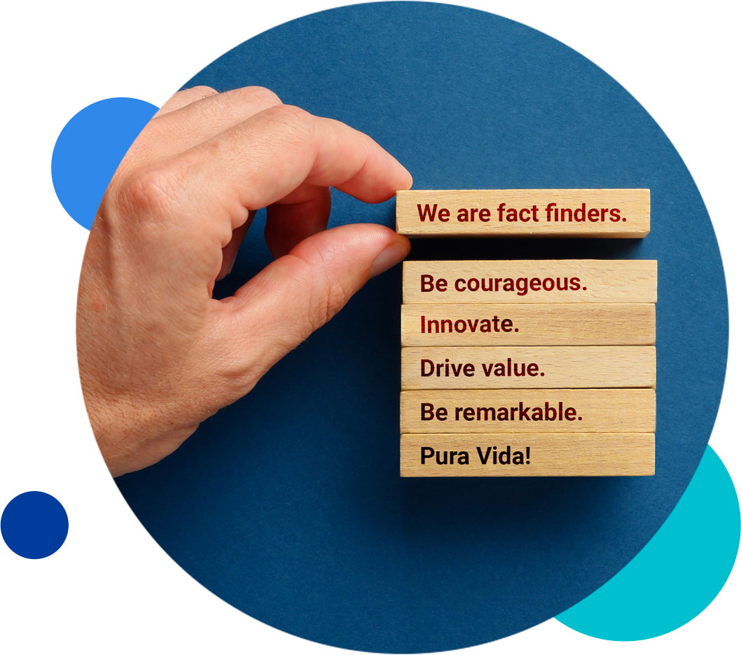 Hand arranging wooden blocks with motivational messages on a blue background.