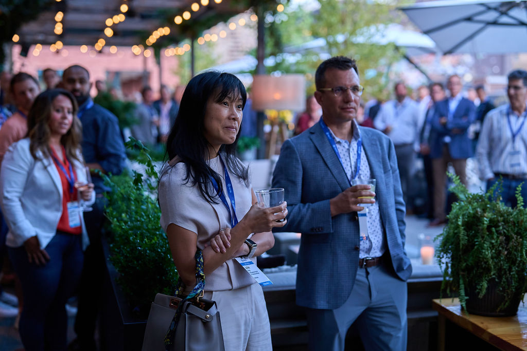 _P1_2806 Business professionals networking at an outdoor evening event.