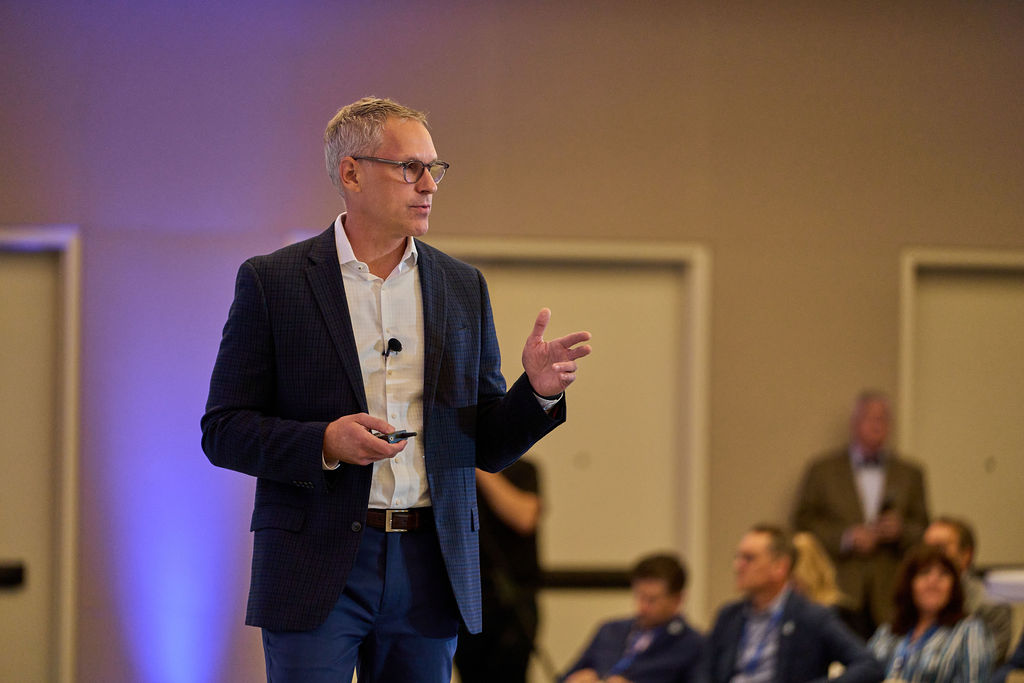 _P1_3168 Man delivering a presentation at a business conference.