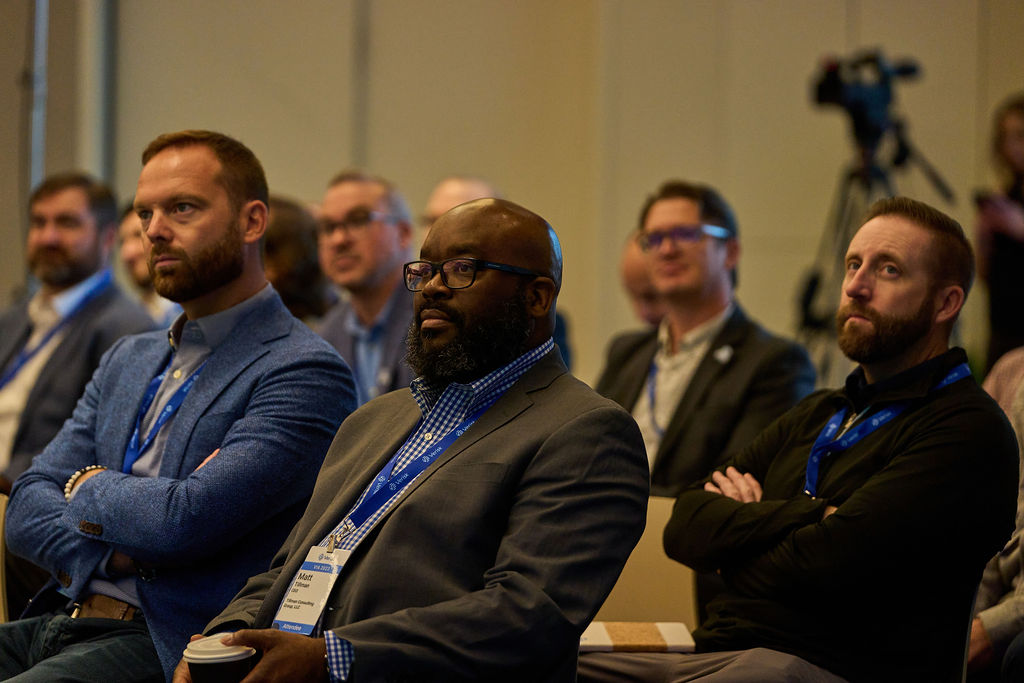 _P1_3171 Audience attentively listening at a business conference.