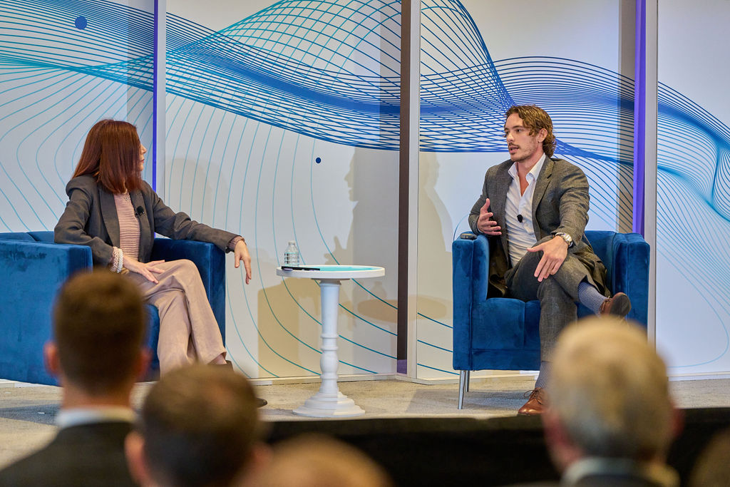 _P1_3468 Two professionals engaged in a panel discussion at a conference.