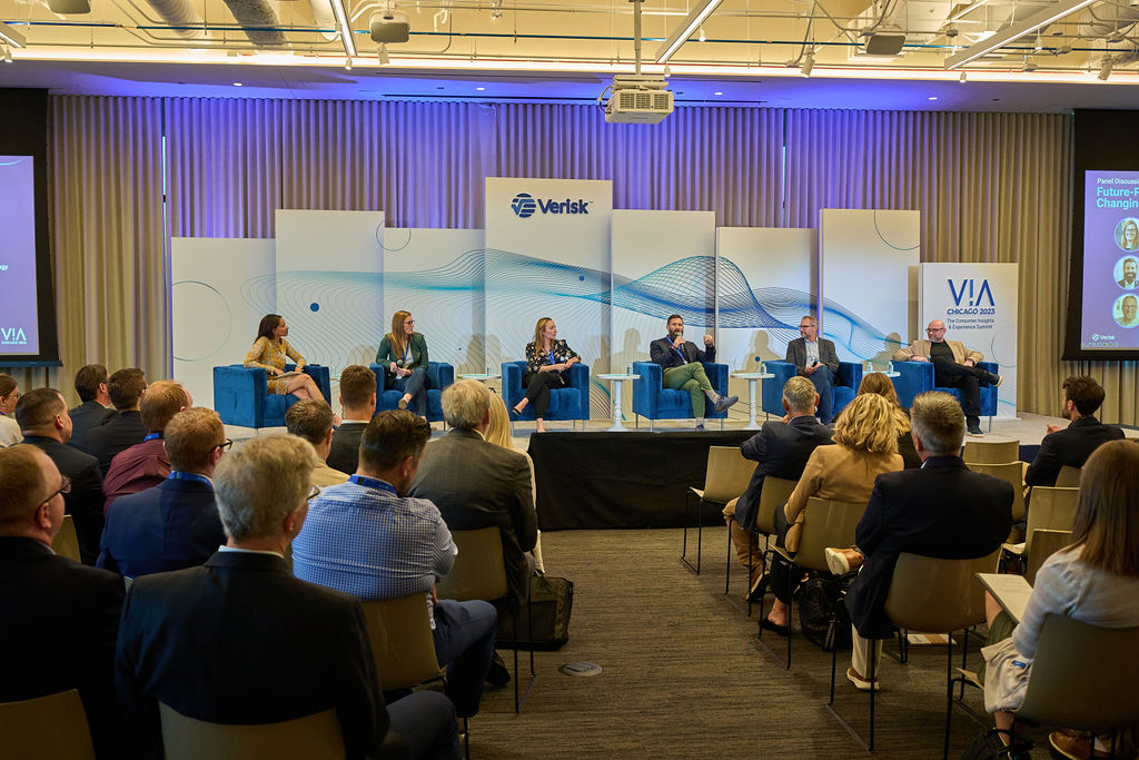 _P2_8120 Panel discussion at Verisk conference with attendees in audience seating.