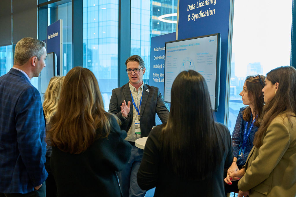 _P2_8277 Group discussion at a business conference focused on data licensing and syndication.