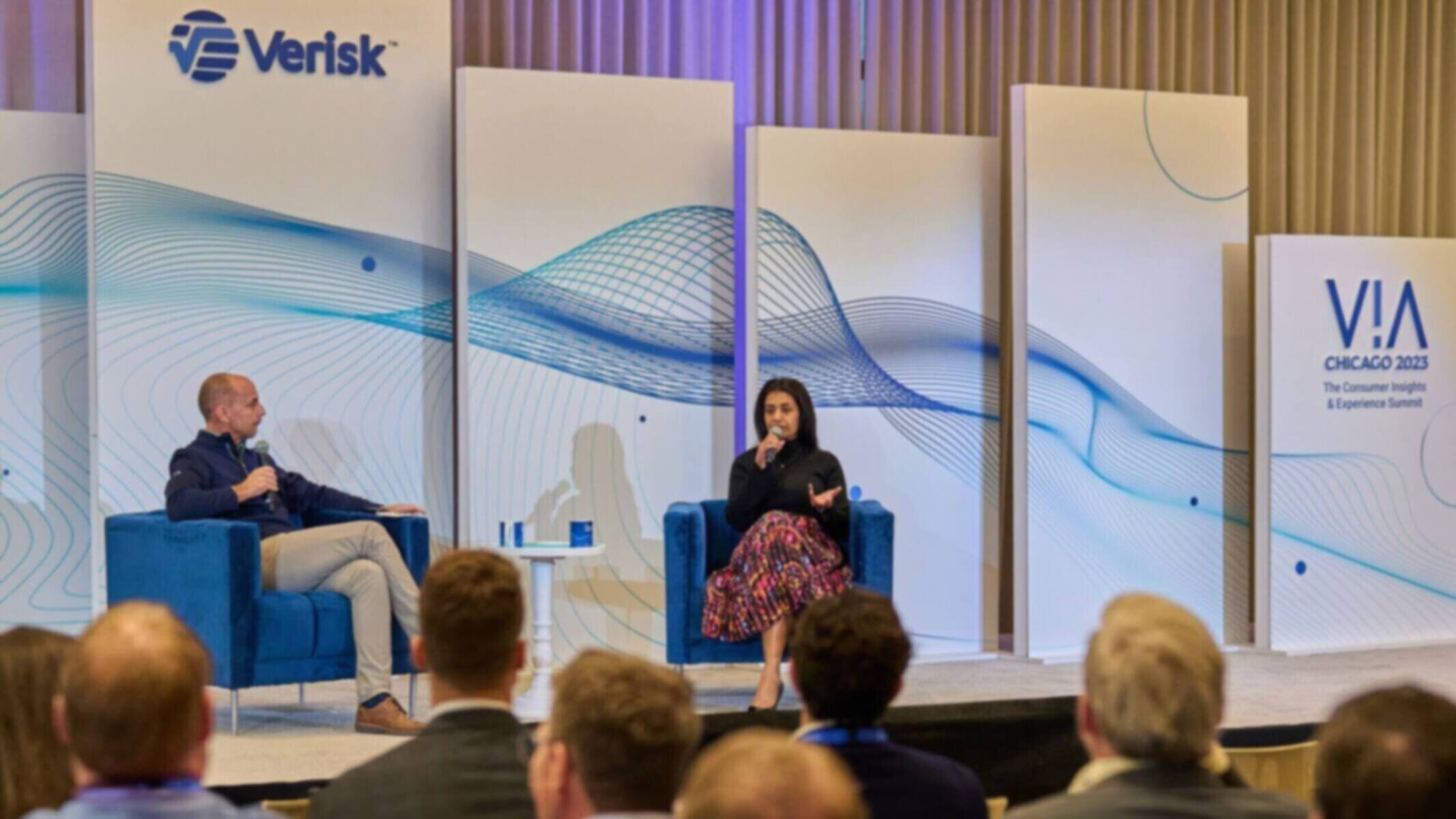 Speakers discussing at VIA Chicago 2023 event by Verisk