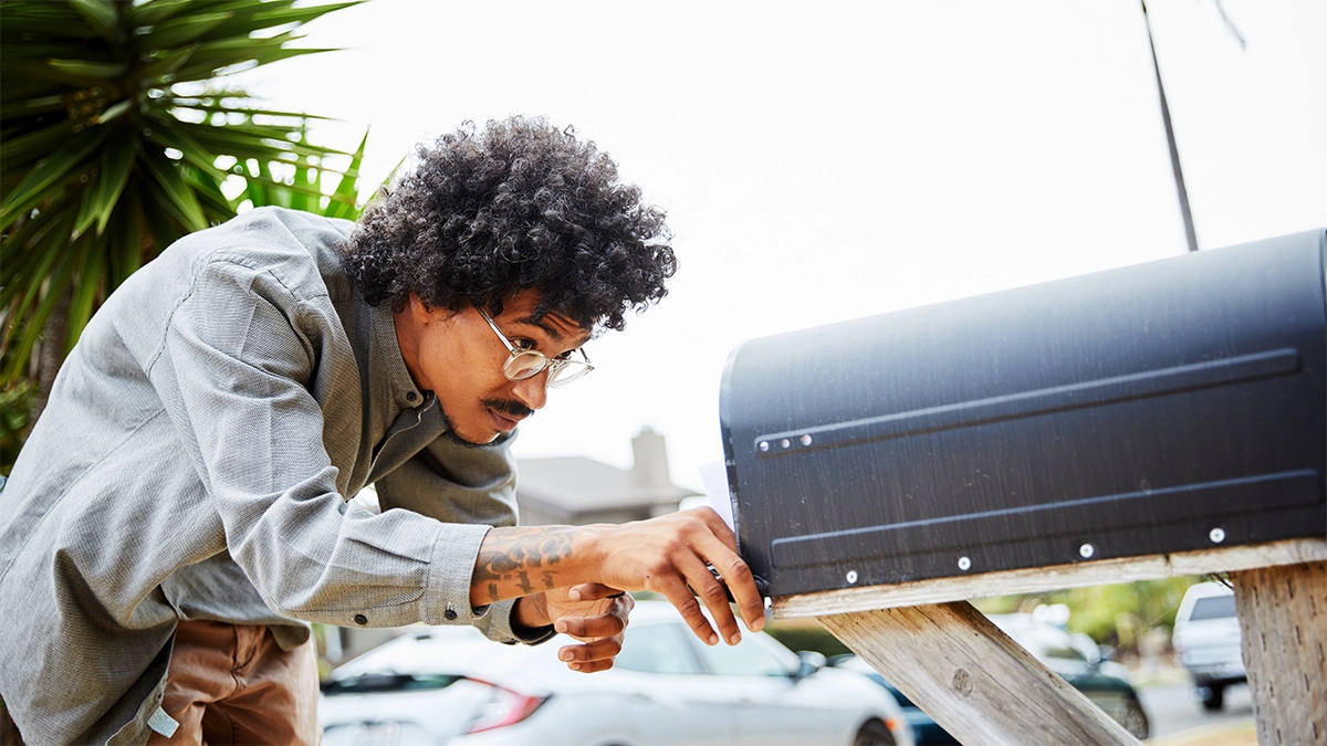 man checking his mailbox