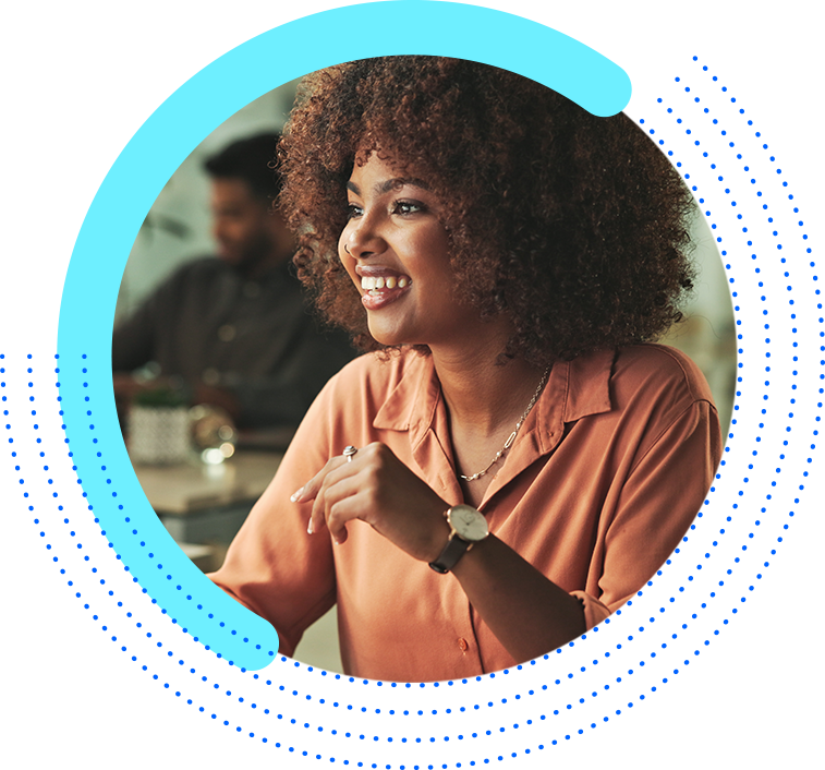 happy marketer looking at her computer screen