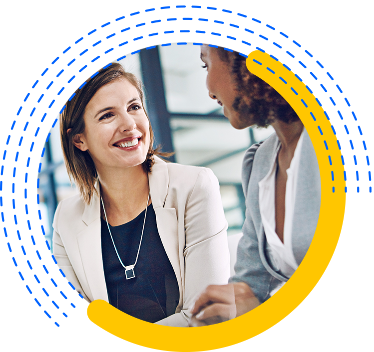 Two Confident Businesswomen at a Desk